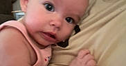 Kinsley joined the competition — help win amazing prizes! adult, arm, baby, beige_shirt, child, closeup, clothing, cuddling, curious, expression, eye_contact, face, head, holding, indoor, infant, person, portrait, skin, soft_light