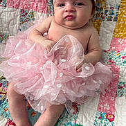 Rylee joined the competition — help win amazing prizes! baby, infant, pink_bow, tutu, headband, grumpy_face, quilt, patchwork, colorful, fabric, sitting, cute, child, portrait, soft, clothing, indoors, expression, skin, person