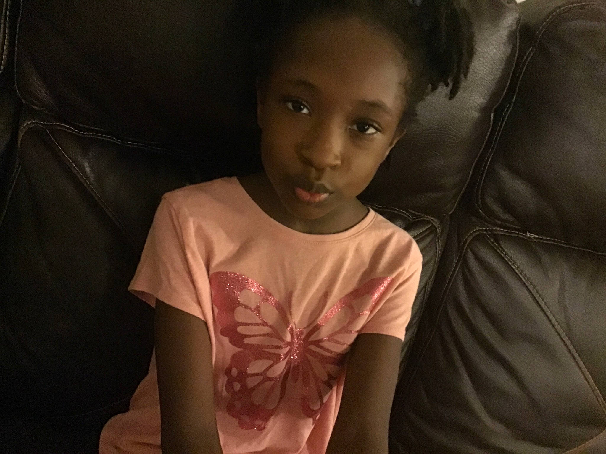 Azaria is registered to the contest to win money with this photo: arm, black_hair, cheek, child, face, human, mouth, neck, person, photography, sitting, smile, toddler