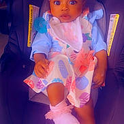 Autumn is registered to the contest to win money with this photo: baby, child, car_seat, headband, bow, dress, pink_socks, pacifier, infant, cute, wide_eyes, seated, clothing, indoor, person, adorable, colorful, fabric, footwear, young