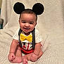 Trevell joined the competition — help win amazing prizes! baby, child, smiling, mickey_mouse_ears, yellow_bow_tie, red_shorts, white_shirt, polka_dot_suspender, sitting, blanket, cute, portrait, indoors, happy, face, headband, infant, young_child, playful, soft_texture