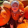 baby, pumpkin, orange, white_pumpkin, headband, smiling, outdoor, fall, autumn, child, cute, clothing, sock, sitting, nature, harvest, festive, sunlight, garden, happy