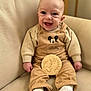 baby, child, clothing, corduroy, couch, cozy, cute, face, feet, hands, happy, indoors, infant, mickey_mouse, overalls, portrait, sitting, smiling, white_shoes, young