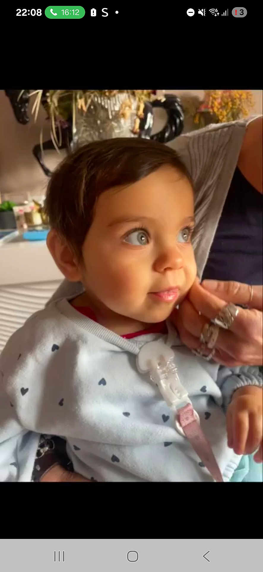 Emmie participe au concours pour gagner de l'argent avec cette photo : child, toddler, face, hand, sweater, heart_pattern, indoor, person, portrait, cute, rings, clothing, baby, expression, skin, hair, eyes, looking_away, cozy, warm_lighting