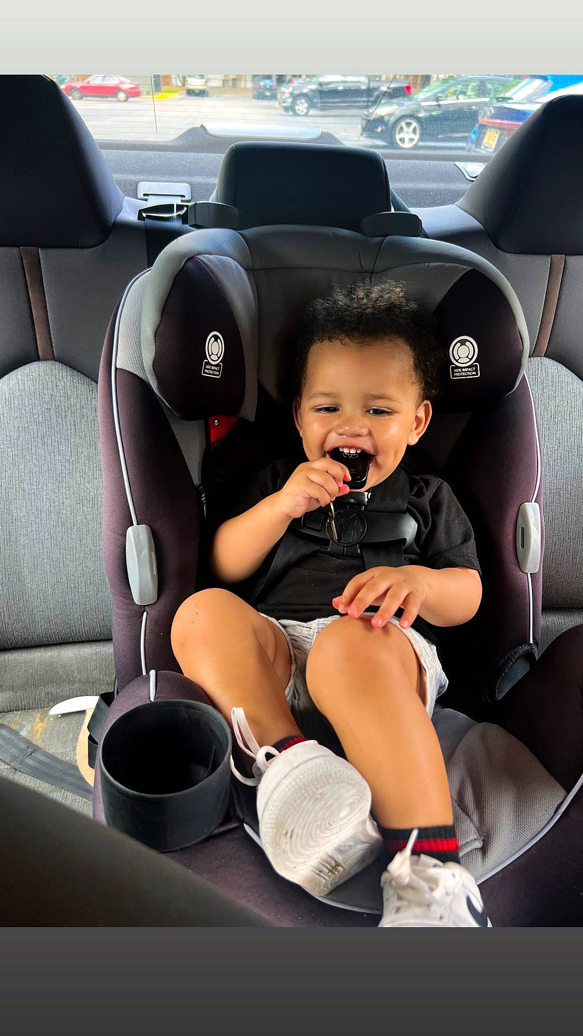 Kabir is registered to the contest to win money with this photo: auto_part, automotive_design, automotive_exterior, automotive_wheel_system, car, car_seat, car_seat_cover, comfort, head_restraint, joy, leg, motor_vehicle, person, personal_luxury_car, seat_belt, smile, sneakers, steering_part, steering_wheel, toddler