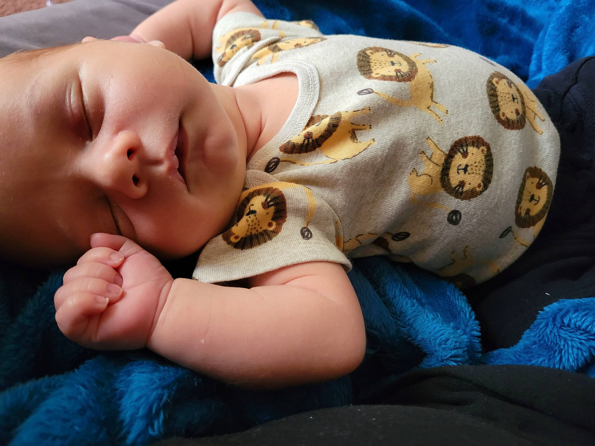 Colter is registered to the contest to win money with this photo: abdomen, baby_toddler_clothing, blue, chest, child, comfort, elbow, electric_blue, eyelash, finger, hand, happy, human_body, human_leg, linens, neck, person, sleeve, thigh, toddler