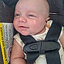 baby, infant, car_seat, child, smile, straps, carrot_pattern, clothing, seatbelt, face, closeup, cute, safety, child_seat, expression, skin, head, person, seat, warning_label