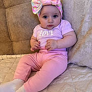 Alyana joined the competition — help win amazing prizes! baby, bow, child, comfortable, couch, cozy, cute, expression, fabric, headband, home, indoors, infant, pink_clothing, portrait, relaxing, sitting, sock, soft_furniture, young_child