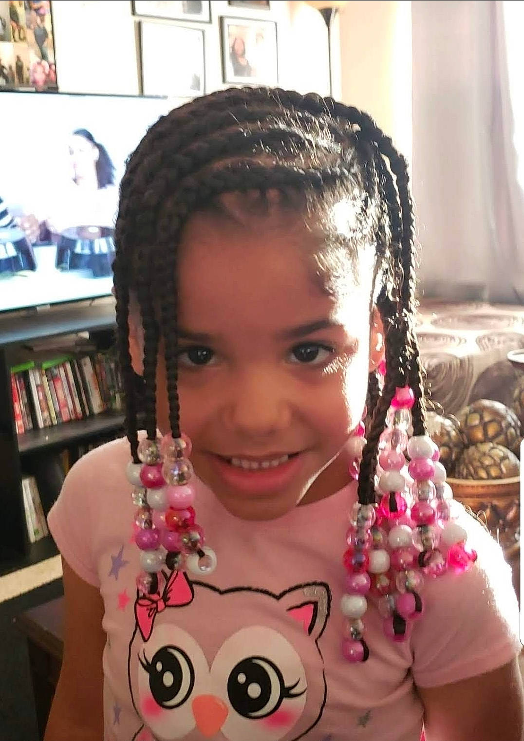 Iyanna is registered to the contest to win money with this photo: black_hair, bookcase, cheek, cool, cornrows, dreadlocks, ear, eyebrow, eyelash, forehead, hairstyle, happy, iris, joy, lip, neck, nose, person, shelf, skin