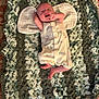 Knox is registered to the contest to win money with this photo: baby, infant, blanket, crochet, pillow, smiling, laughing, romper, clothing, footwear, barefoot, lying_down, indoor, soft_texture, child, cute, happy, person, head, skin