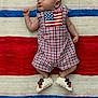 baby, infant, sleeping, blanket, american_flag, romper, footwear, shoes, patterned_clothing, plaid, red, white, blue, stars, stripes, child, portrait, indoors, cute, peaceful