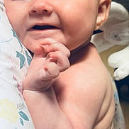 Amalia joined the competition — help win amazing prizes! baby, infant, face, skin, hand, expression, cute, child, newborn, portrait, soft, plush, bedding, pastel, floral, comfort, indoors, person, closeup, smile