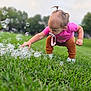 baby, brown_pants, bubbles, child, curious, daylight, exploring, grass, green_lawn, hair_tied, nature, outdoor, pacifier, park, person, pink_shirt, playing, toddler, white_shoes, young_child