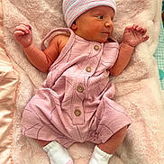 Ailanna joined the competition — help win amazing prizes! newborn, baby, infant, pink, hat, socks, blanket, soft_texture, sleeping_area, cute, small_hands, small_feet, clothing, portrait, resting, indoors, warm, comfortable, child, lying_down