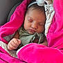 baby, newborn, sleeping, blanket, pink, headband, flower, soft_texture, cozy, infant, child, wrapped, portrait, cute, peaceful, closeup, hand, face, indoors, car_seat