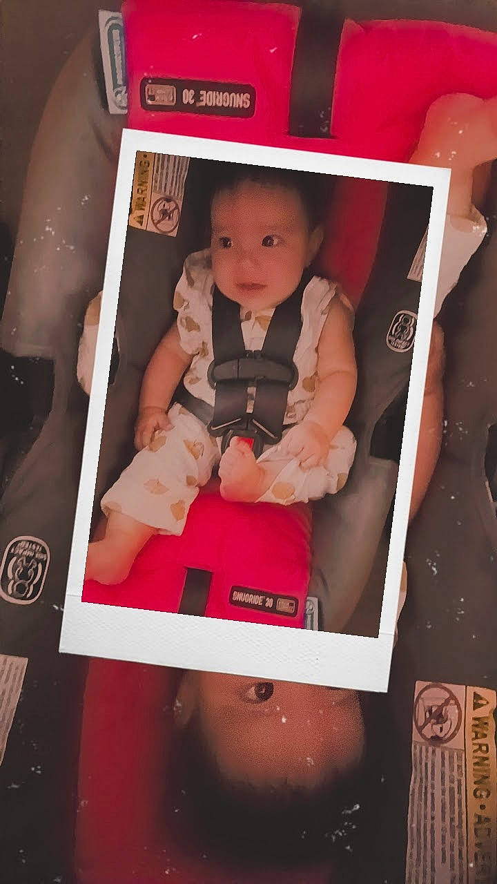 Celeste is registered to the contest to win money with this photo: baby, baby_carriage, baby_toddler_clothing, beauty, box, child, comfort, electronic_device, finger, flash_photography, fun, happy, magenta, material_property, person, pink, red, room, skin, snapshot