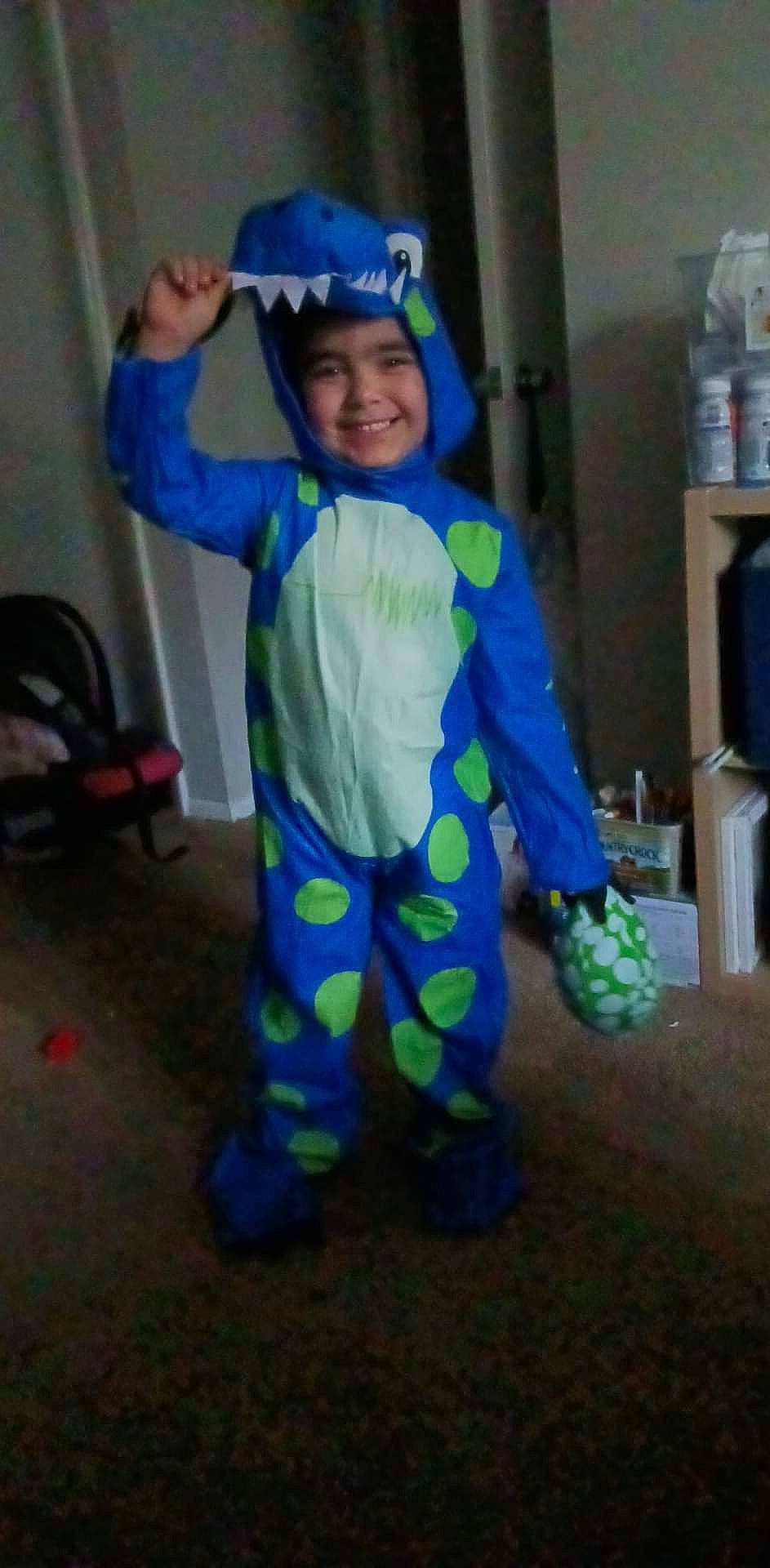Gustavo is registered to the contest to win money with this photo: baby_toddler_clothing, child, clothing, costume, electric_blue, fun, headgear, headwear, helmet, joy, overall, pajamas, person, personal_protective_equipment, play, room, sleeve, smile, sweatpant, t_shirt