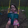 toddler, child, swing, playground, outdoor, smile, dress, plaid, grass, fence, tree, house, yellow_chain, play_equipment, happy, fun, evening, park, nature, person