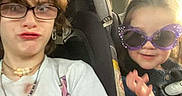 Chloe joined the competition — help win amazing prizes! child, children, car_seat, glasses, sunglasses, tshirt, seatbelt, playful, portrait, happy, casual, indoor, transportation, person, young, funny_face, smile, hair, seat, window