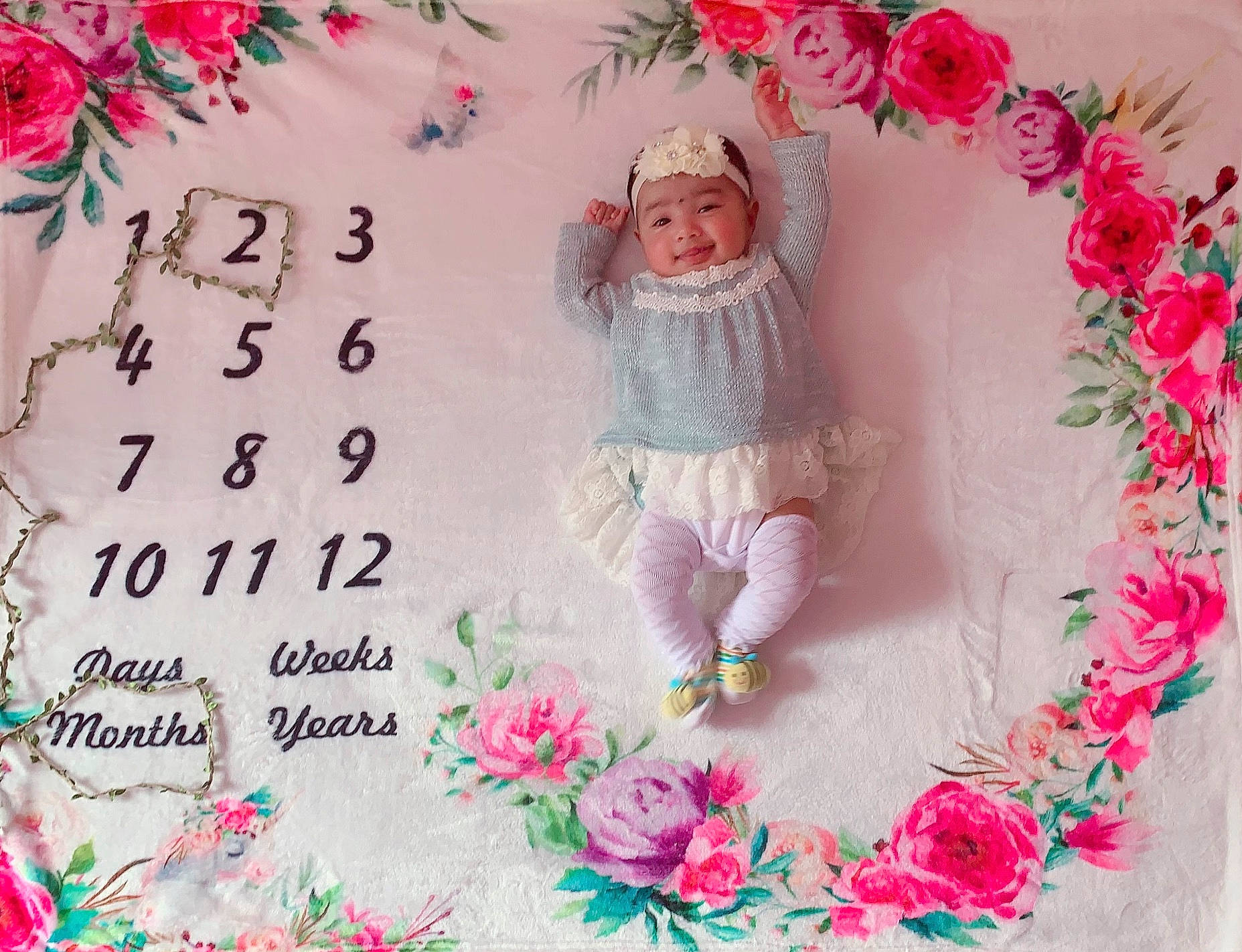 Emani is registered to the contest to win money with this photo: child, flower, font, headwear, needlework, person, pink, plant, rose, text