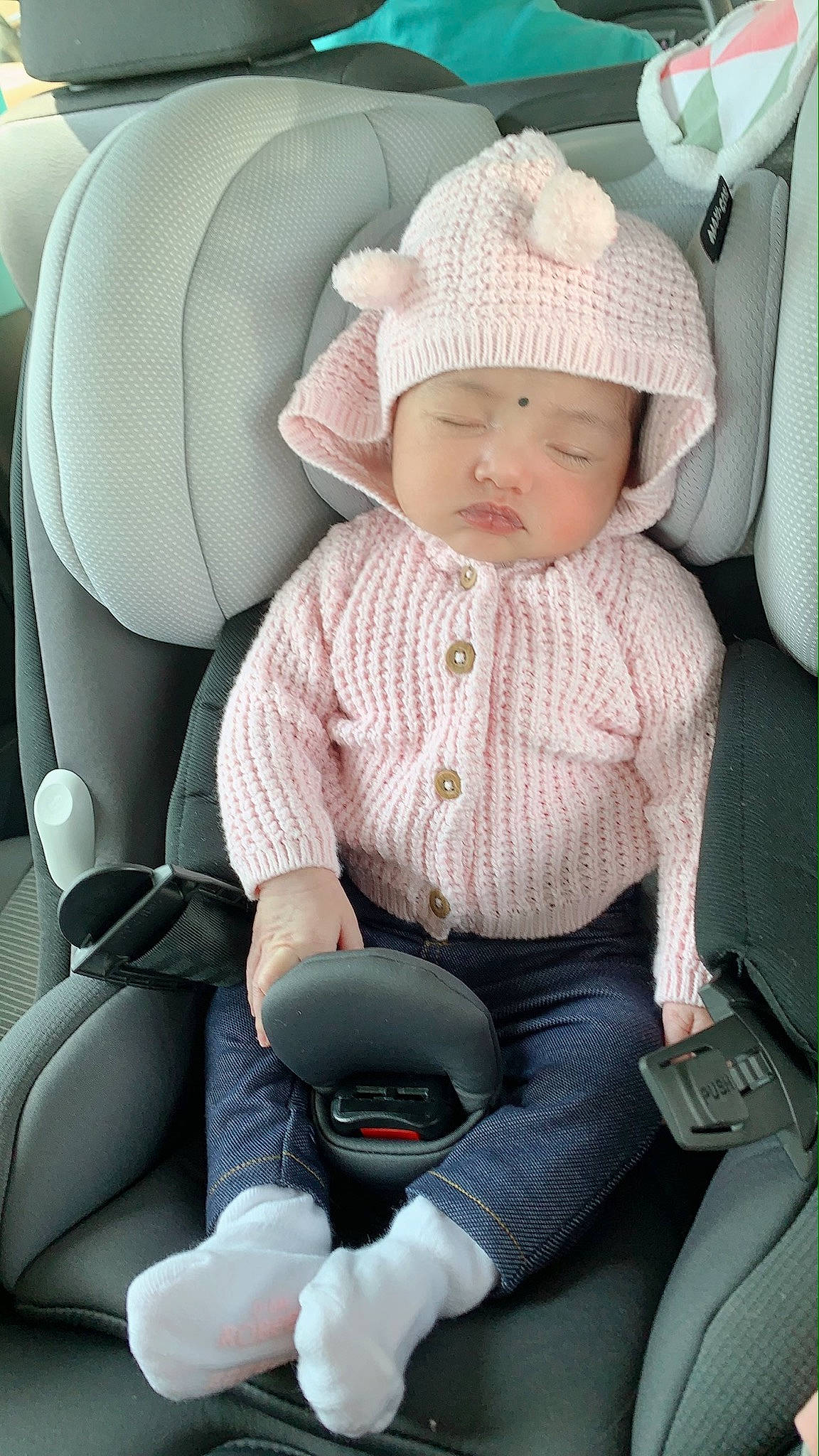 Emani is registered to the contest to win money with this photo: auto_part, baby, baby_in_car_seat, car_seat, car_seat_cover, child, headwear, person, seat_belt, toddler