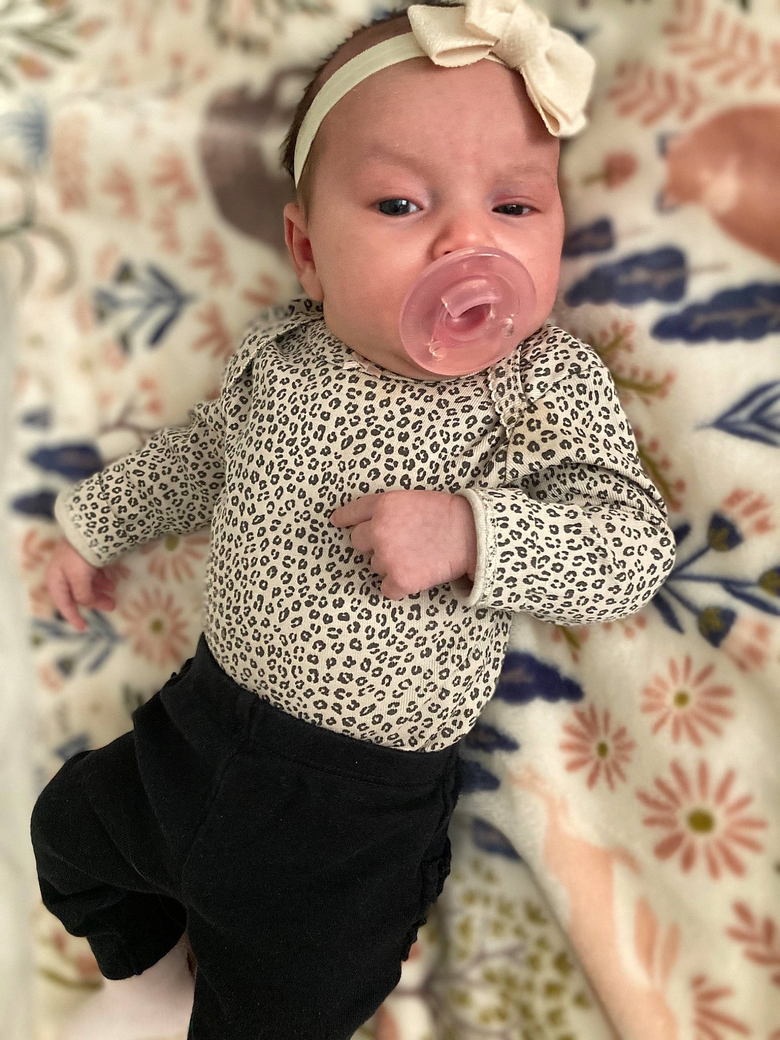 Aniya is registered to the contest to win money with this photo: baby, baby_toddler_clothing, child, eye, face, fashion_accessory, happy, head, headgear, human_body, pattern, person, photograph, pink, skin, sleeve, textile, toddler, toy, waist