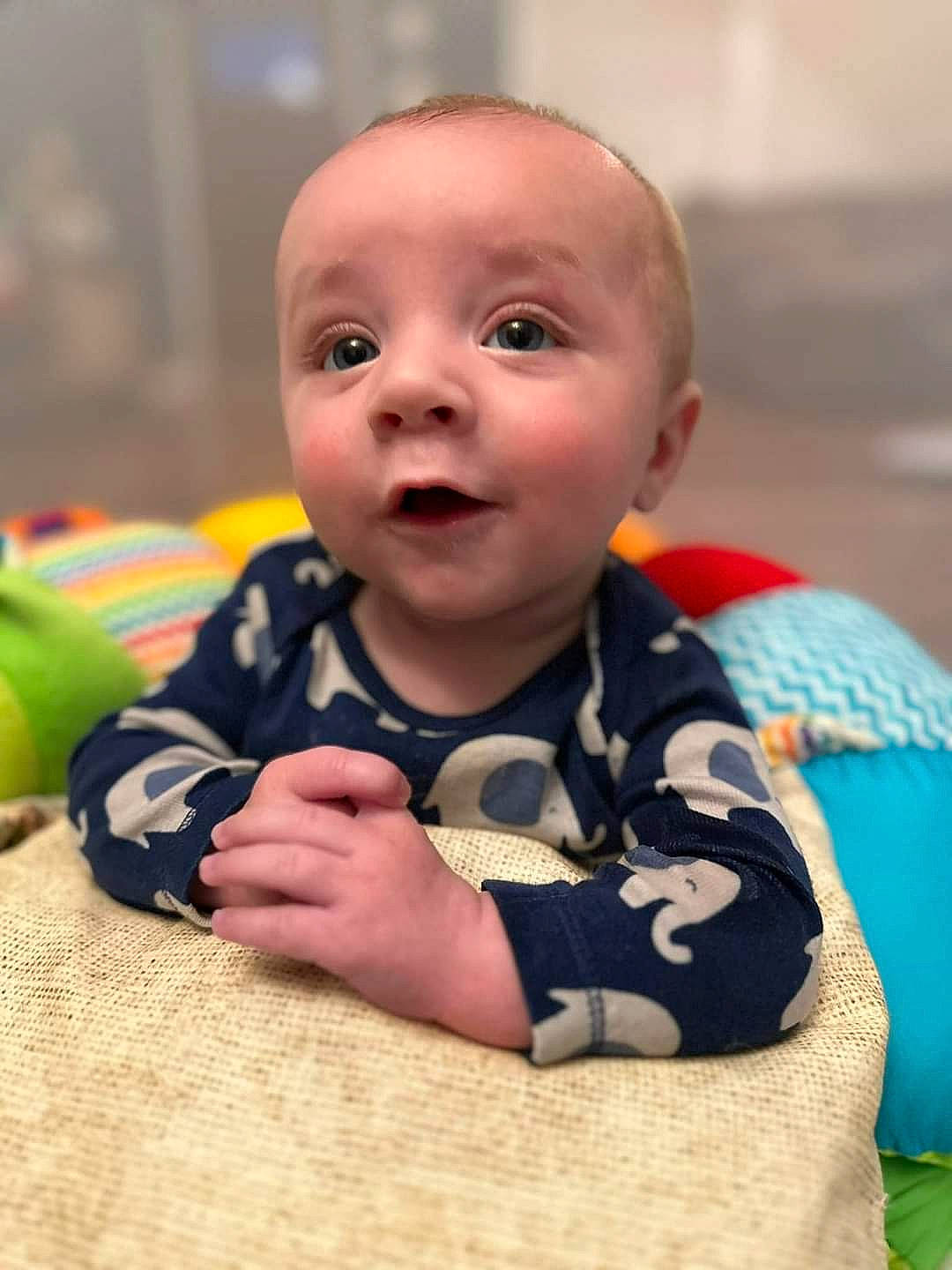 Connor joined the competition — help win amazing prizes! baby, baby_toddler_clothing, ball, cheek, child, comfort, flooring, fun, grass, happy, iris, nose, person, room, sitting, skin, sleeve, smile, toddler, toy