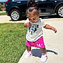 Rhemi joined the competition — help win amazing prizes! black_suv, car, casual_clothing, child, curly_hair, earrings, grass, minnie_mouse, outdoor, person, pink_shorts, pink_sneakers, scrunchie, shadow, sidewalk, sunny_day, toddler, tshirt, walking, white_sneakers
