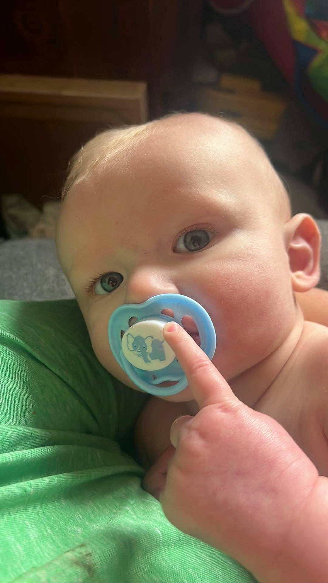 Franklin is registered to the contest to win money with this photo: baby, baby_toddler_clothing, cheek, child, chin, curious, ear, eyebrow, eyelash, finger, gesture, iris, lip, mouth, nail, neck, nose, person, skin, thumb