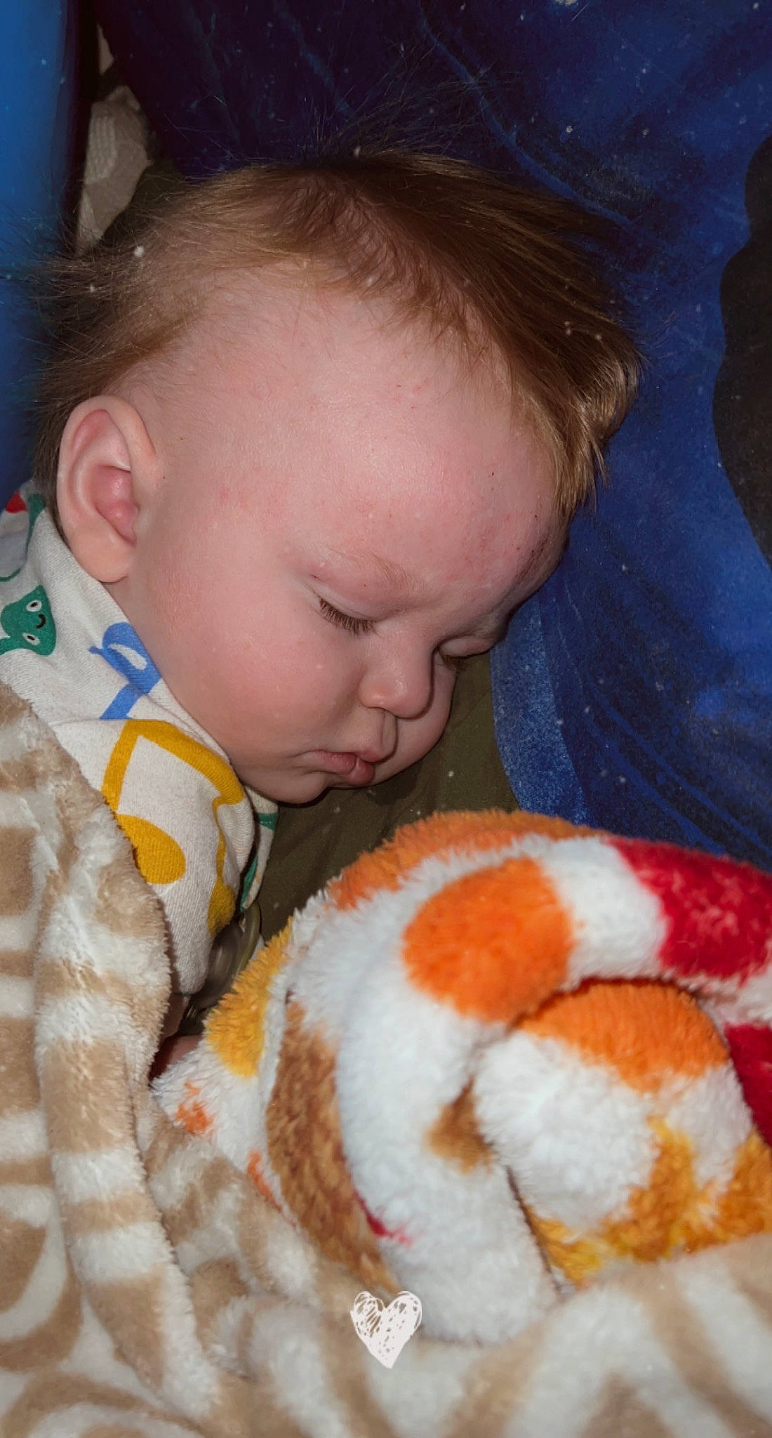 Wyatt is registered to the contest to win money with this photo: baby, baby_sleeping, baby_toddler_clothing, cheek, child, comfort, ear, eyebrow, facial_expression, fur, iris, linens, mouth, nose, orange, person, skin, textile, toddler, toy