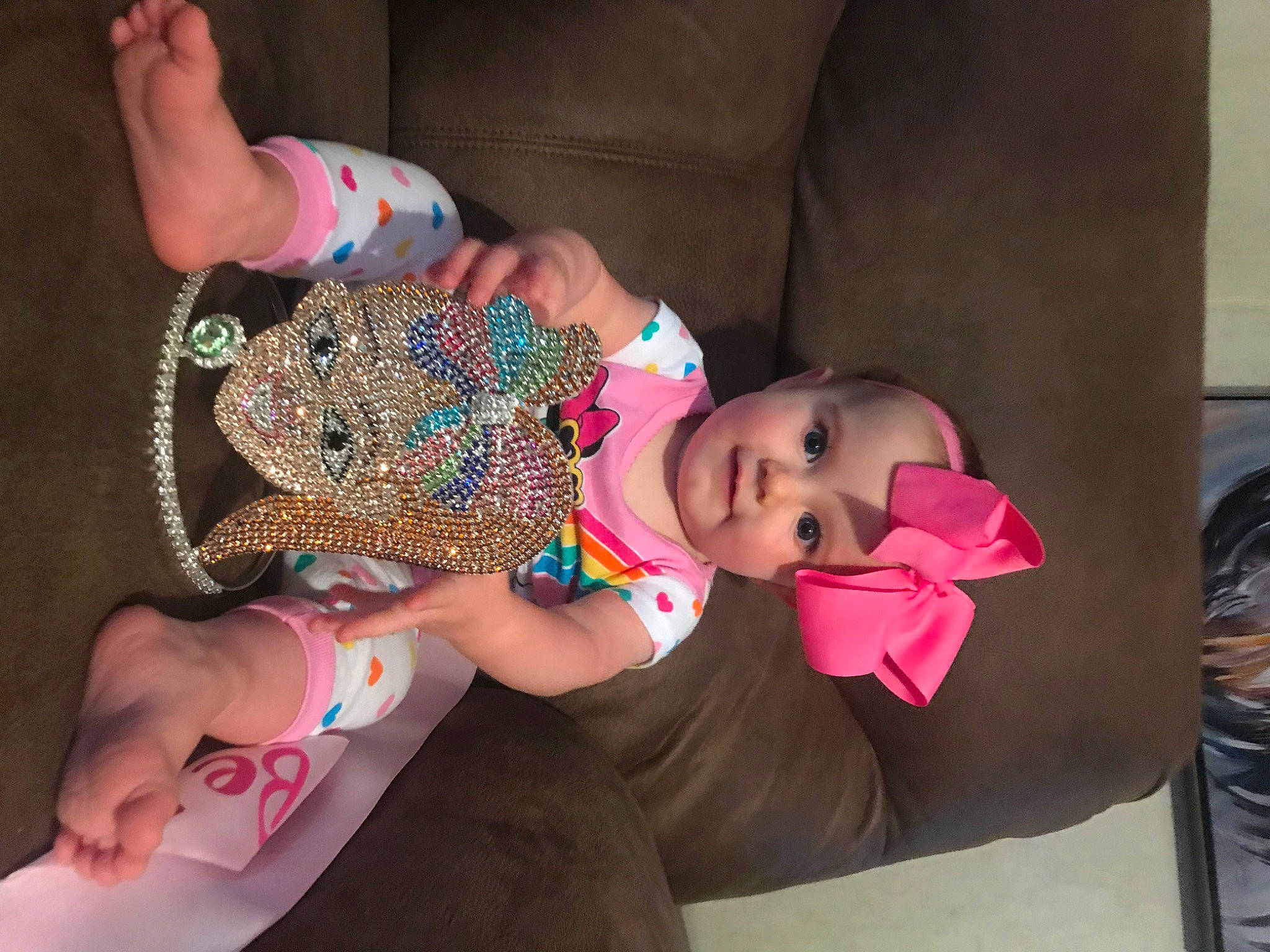 Collins is registered to the contest to win money with this photo: baby, child, fashion_accessory, hand, headwear, person, play, technology, toddler