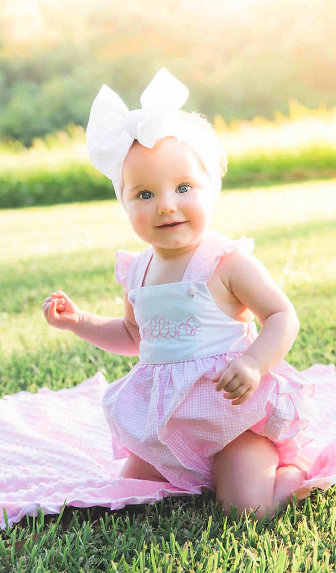 Collins is registered to the contest to win money with this photo: baby, baby_products, baby_toddler_clothing, ballet_tutu, child, clothing, costume, design, dress, grass, happy, headgear, headwear, joy, pattern, person, pink, plant, product, sitting
