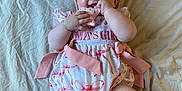 Madison is registered to the contest to win money with this photo: baby, child, infant, pink_bow, headband, smiling, toy, star_shaped_toy, blanket, clothing, ribbons, cute, happy, cheerful, lying_down, indoors, soft_lighting, infant_girl, baby_girl, portrait