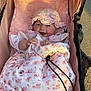 Madison is registered to the contest to win money with this photo: baby, smiling, stroller, blanket, floral_pattern, hat, pink, child, outdoor, sunlight, cute, infant, happy, clothing, person, closeup, seat, warm, soft, cozy