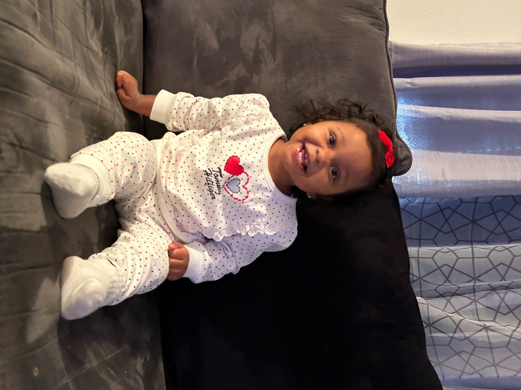 Brooklyn joined the competition — help win amazing prizes! baby, baby_toddler_clothing, child, cloud, comfort, face, fence, flash_photography, fun, gesture, happy, human_body, joy, person, room, sitting, sleeve, smile, toddler