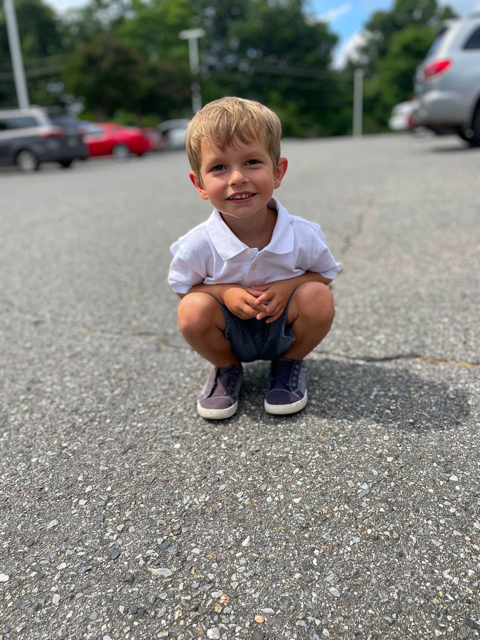 Jake joined the competition — help win amazing prizes! asphalt, automotive_design, automotive_tire, car, face, grass, joy, motor_vehicle, person, personal_luxury_car, public_space, road, road_surface, rolling, sidewalk, sky, smile, t_shirt, tire, toddler