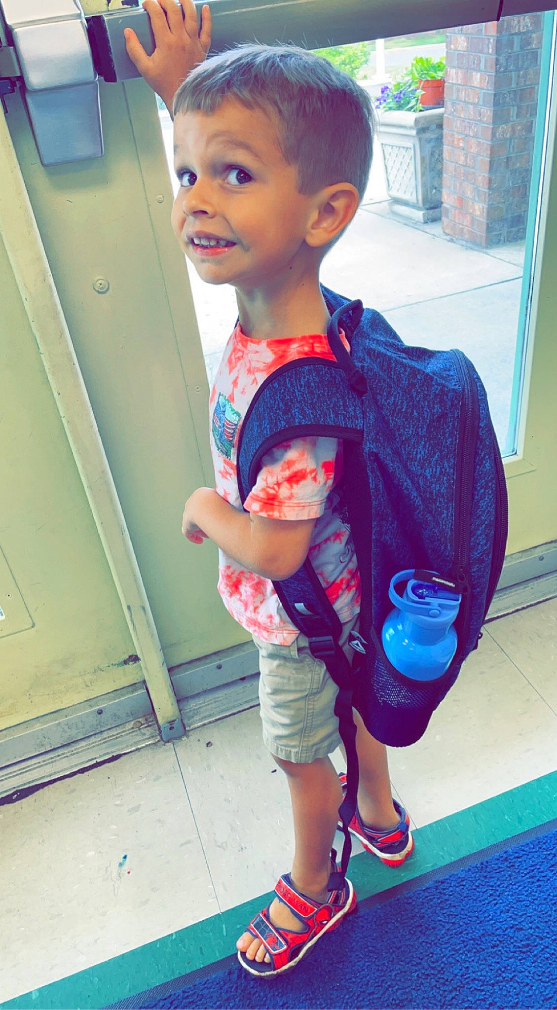 Jake is registered to the contest to win money with this photo: baby_toddler_clothing, cool, electric_blue, face, flooring, hairstyle, happy, joint, knee, person, photograph, shorts, sleeve, smile, snapshot, standing, t_shirt, thigh, toddler, trunk