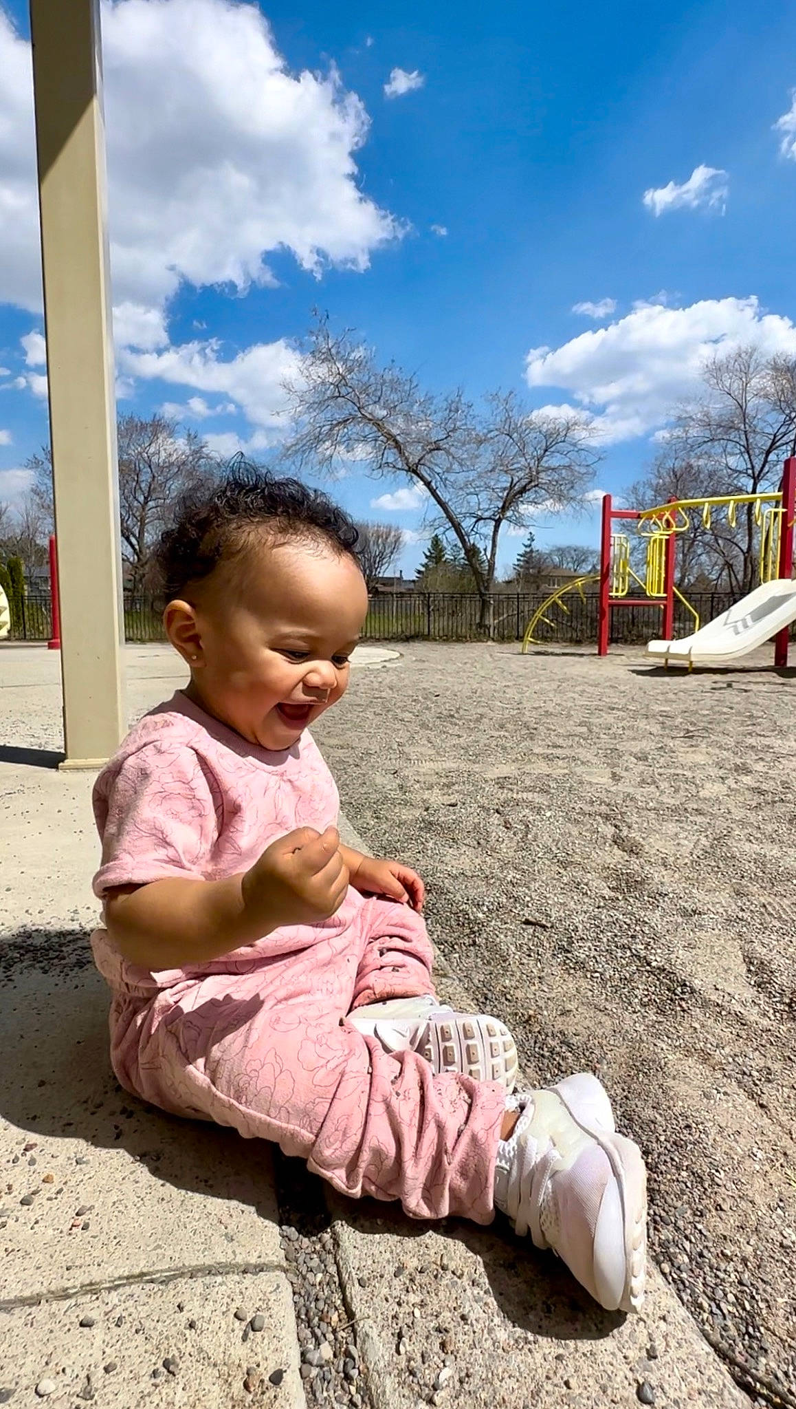 Aura is registered to the contest to win money with this photo: baby, child, city, cloud, foot, fun, grass, hand, happy, leisure, people_in_nature, person, play, recreation, sandal, sitting, skin, sky, toddler, tree