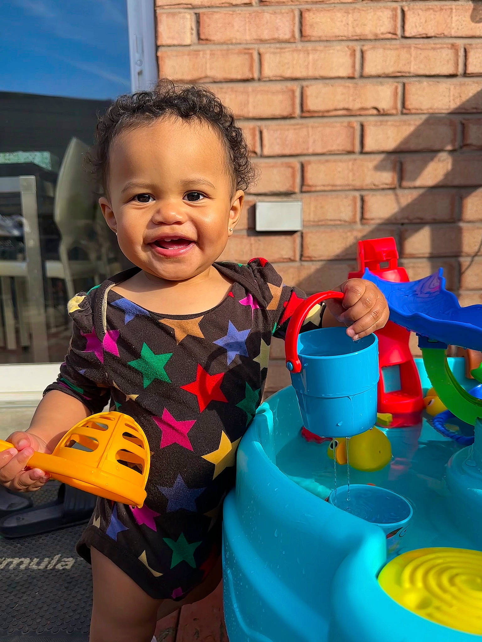 Aura joined the competition — help win amazing prizes! baby, baby_toddler_clothing, blue, child, electric_blue, facial_expression, fun, happy, human_settlement, leisure, people, person, plastic, play, public_space, recreation, sitting, smile, t_shirt, toddler