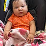 Alahia joined the competition — help win amazing prizes! baby, child, infant, car_seat, blanket, orange_clothing, polka_dot, pink, minnie_mouse, face, hand, cute, indoors, warning_label, seated, person, young_child, cozy, portrait, resting