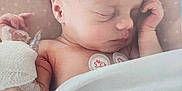 Emy participe au concours pour gagner de l'argent avec cette photo : baby, blanket, child, cute, face, hand, healthcare, hospital, indoors, infant, medical_bandage, newborn, peaceful, pillow, pink, resting, skin, sleeping, soft, wrapped