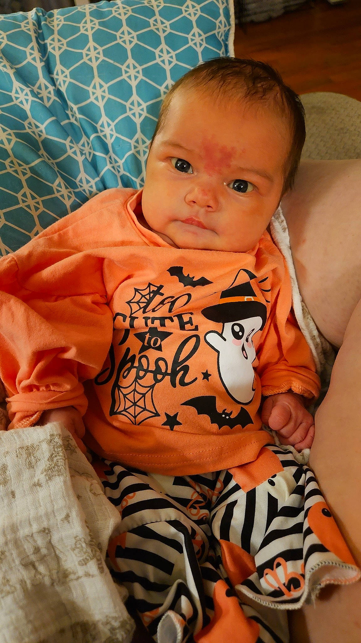 Makenleigh is registered to the contest to win money with this photo: arm, baby, baby_toddler_clothing, comfort, eye, facial_expression, finger, hairstyle, hand, head, human_body, leg, mouth, neck, nose, orange, person, shoulder, skin, stomach