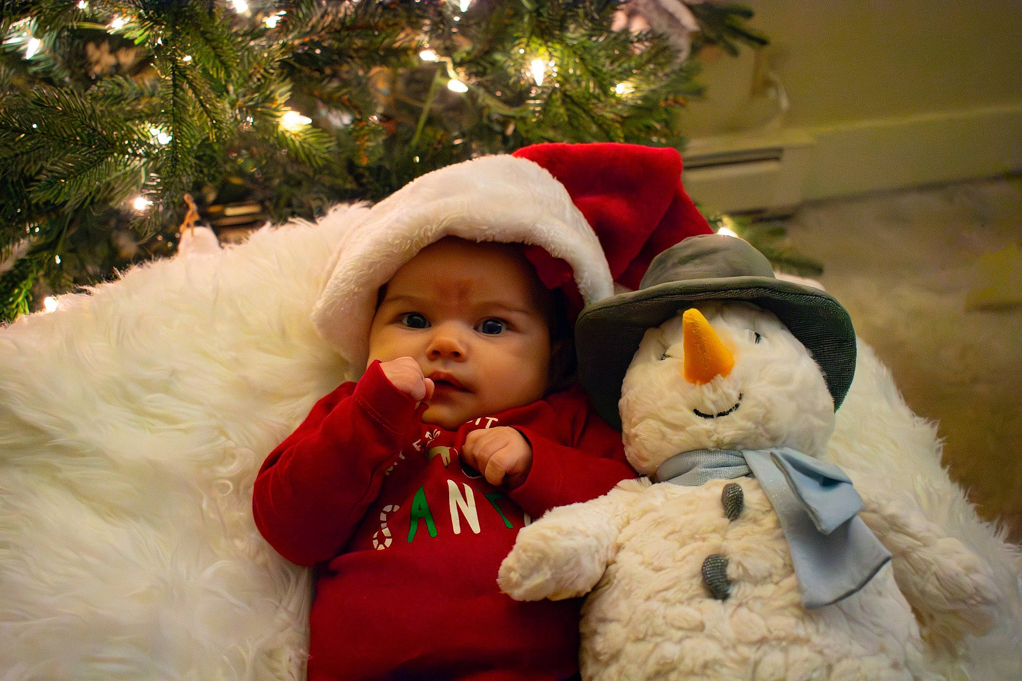 Makenleigh joined the competition — help win amazing prizes! christmas, christmas_decoration, christmas_eve, christmas_ornament, christmas_tree, event, facial_expression, fun, fur, happy, hat, head, headwear, holiday, human_body, ornament, people, person, toddler, toy