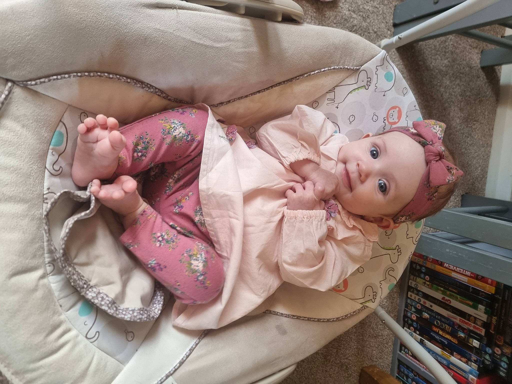 Imogen is registered to the contest to win money with this photo: baby, baby_products, baby_toddler_clothing, cheek, child, comfort, doll, eye, fashion, fashion_accessory, headwear, jewellery, linens, pattern, person, pink, product, shelf, skin, textile
