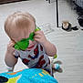 Roxas joined the competition — help win amazing prizes! baby, cabinet, chair, child, clothing, cute, floor, furniture, green_sunglasses, home, indoor, pajamas, person, plastic_bottle, playful, shoe, sock, spiderman, toddler, toy
