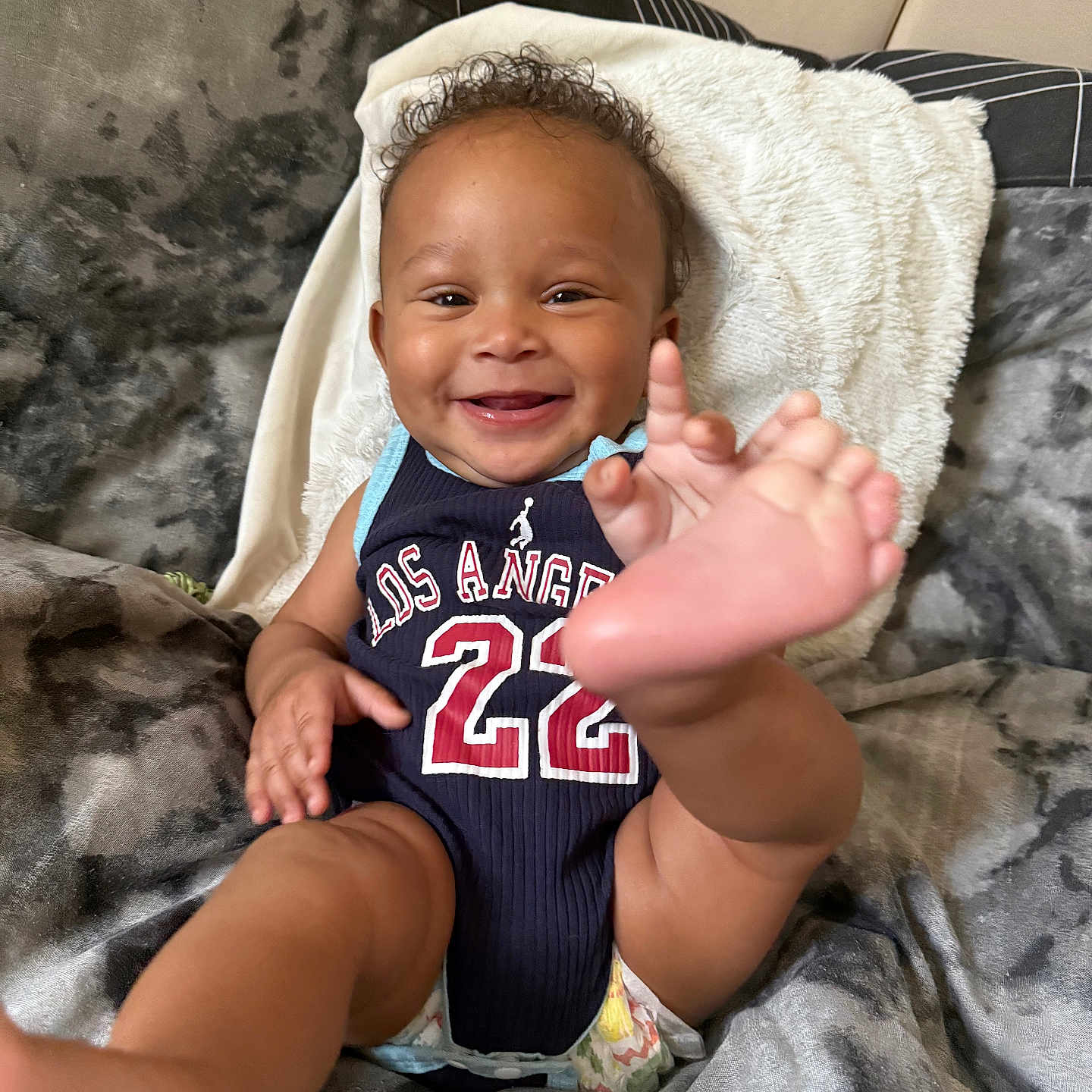 Remir joined the competition — help win amazing prizes! baby, bed, blanket, child, clothing, curly_hair, cute, diaper, foot, hand, happy, head, indoor, infant, jersey, person, portrait, relaxing, skin, smiling