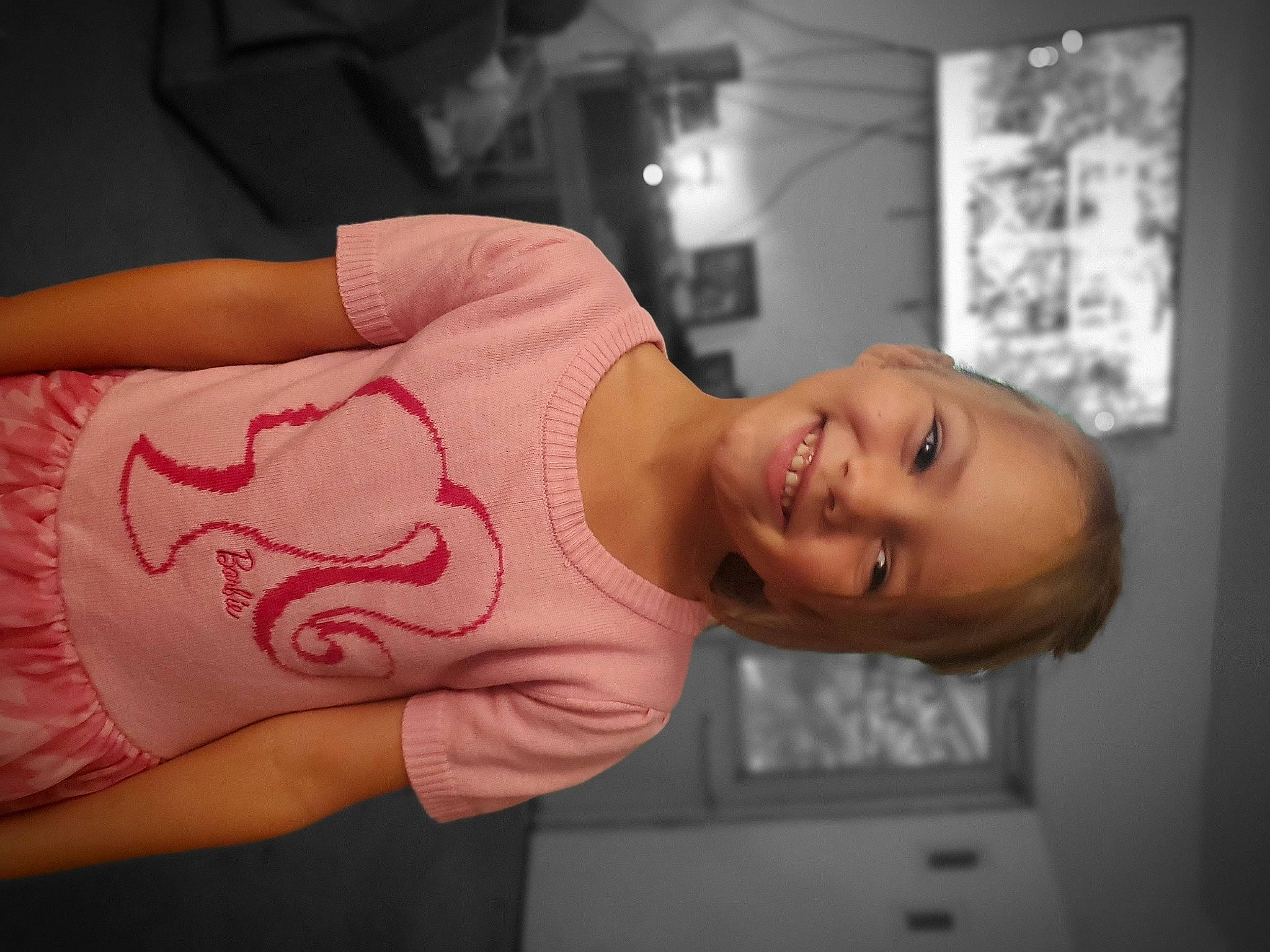 April is registered to the contest to win money with this photo: abdomen, arm, chest, elbow, eyebrow, eyelash, finger, human_body, human_leg, joint, joy, mouth, neck, person, shoulder, sleeve, smile, stomach, thigh, toddler