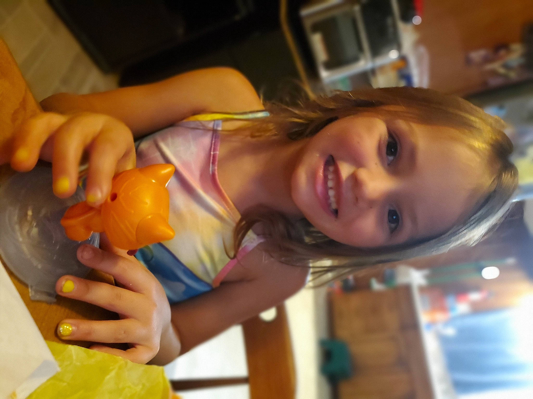 April is registered to the contest to win money with this photo: child, drink, food, fruit, fun, gourd, hand, joy, juice, nail, natural_foods, orange, person, plant, pumpkin, room, smile, sweetness, tableware, vacation