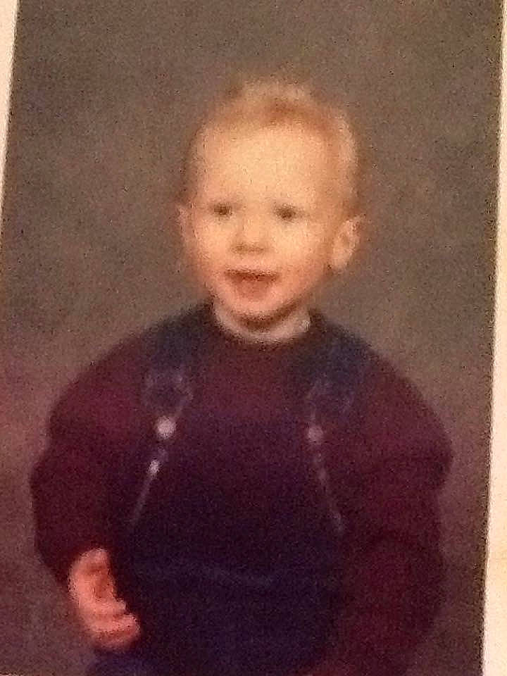 Bradley is registered to the contest to win money with this photo: cheek, child, face, family, painting, person, portrait, smile, standing, toddler