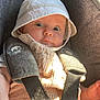 baby, child, car_seat, hat, corduroy, straps, sunlight, drool, wide_eyes, clothing, seatbelt, infant, cute, portrait, seat, sitting, child_seat, baby_hat, baby_clothes, indoors